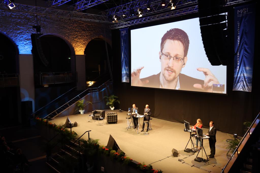 Snowden gesticulates heavily