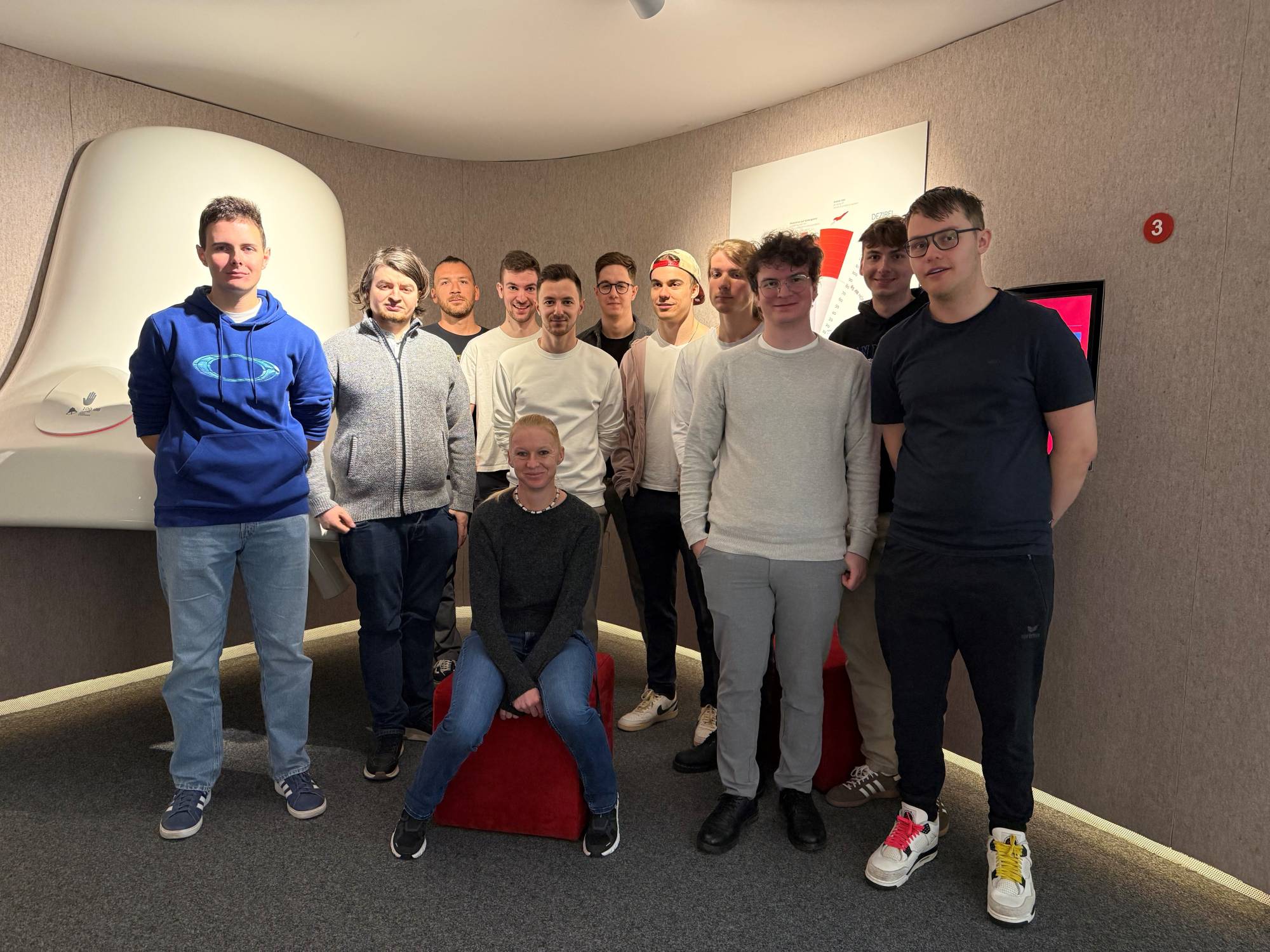 <p>The SBT students together with lecturer Silvia Öttl admist the vast installation landscape of the AUDIOVERSUM Science Center.</p>