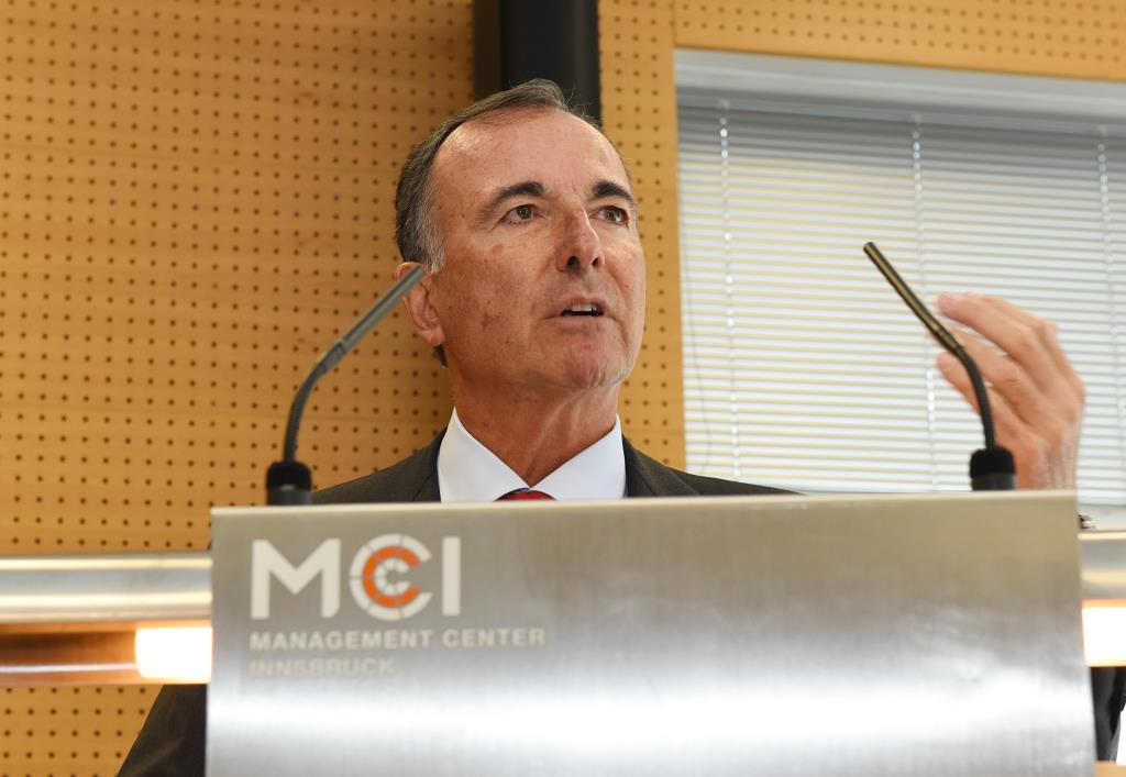 Franco Frattini behind the lectern