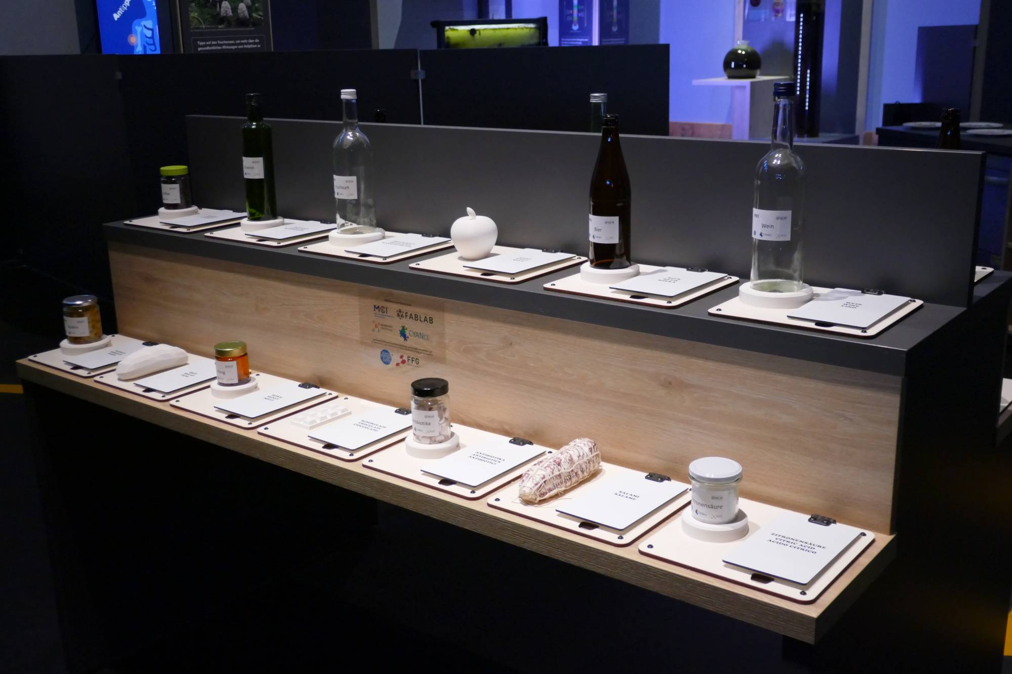 <p>The grocery store display provides information about which products rely on microbes to play a crucial role in their production. ©MCI/Sonja Hirschl-Neuhauser</p>