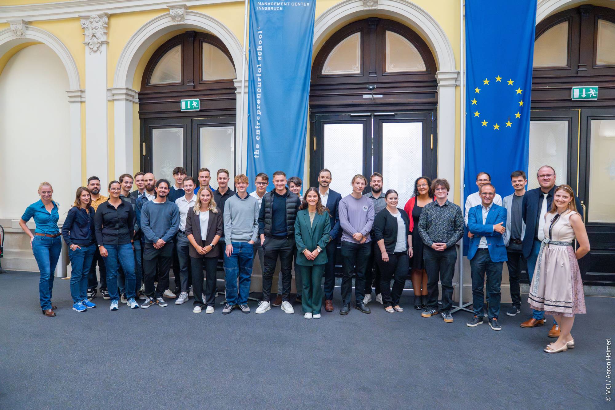 <p>The study program team, together with the corporate partners from North, East and South Tyrol as well as students from the existing cohorts, ceremoniously welcomed the new students at the joint kick-off. ©MCI/Aaron Heimerl</p>
