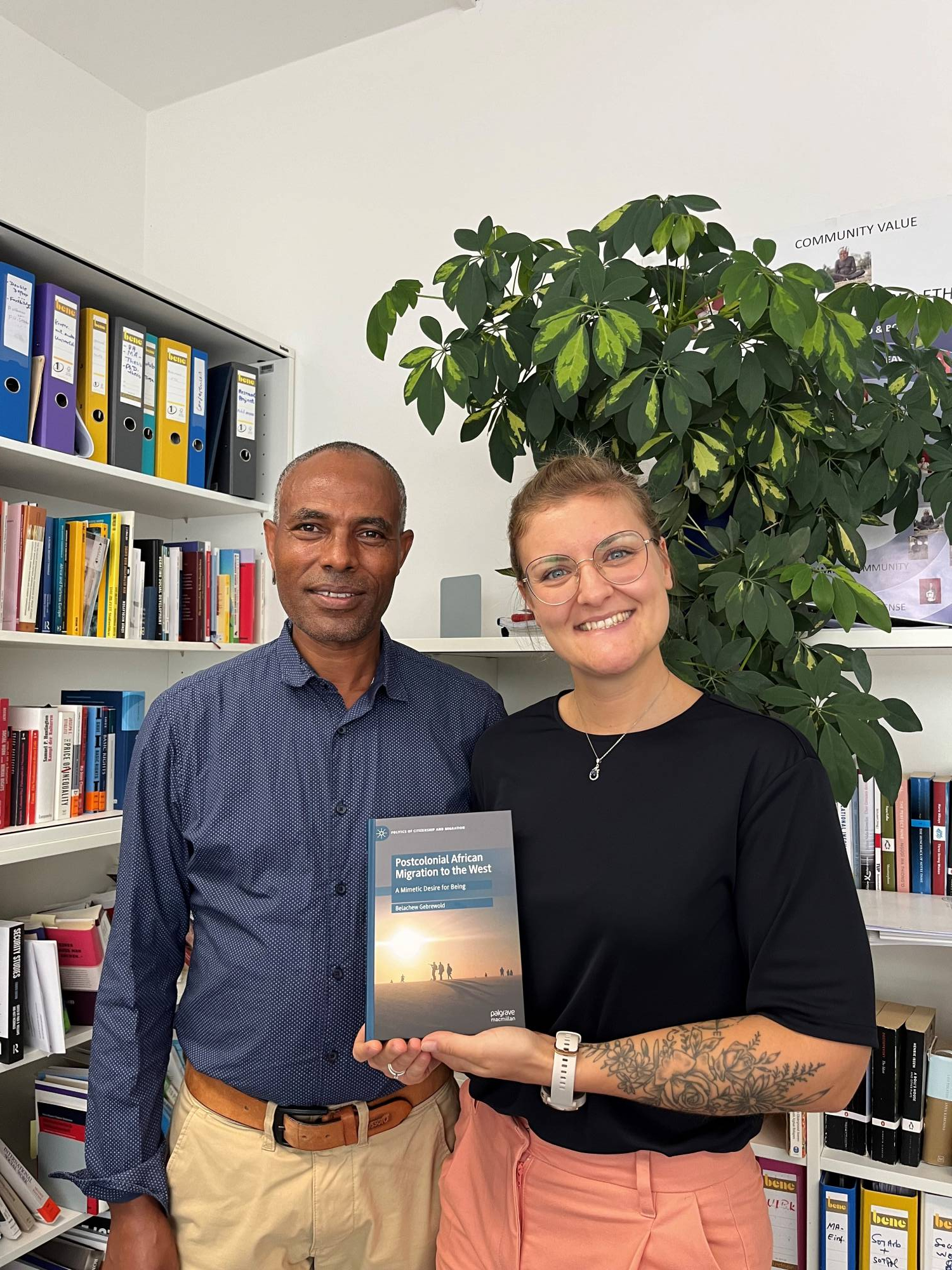 <p>Book publication “Postcolonial African Migration to the West: A Mimetic Desire for Being”. From left to right.: Belachew Gebrewold | Author & Verena Schmid | Book cover designer © MCI/Department Social Work</p>