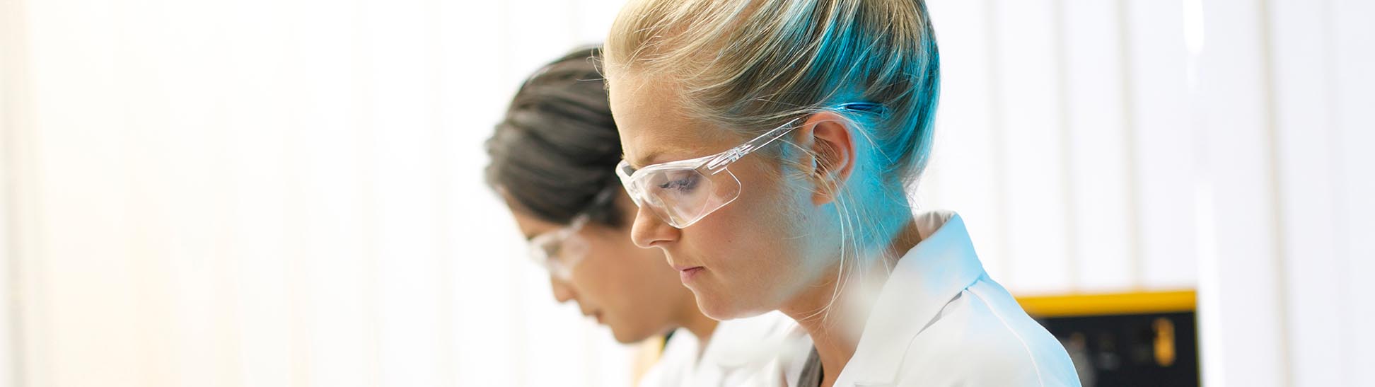 Two students doing focused work in laboratory