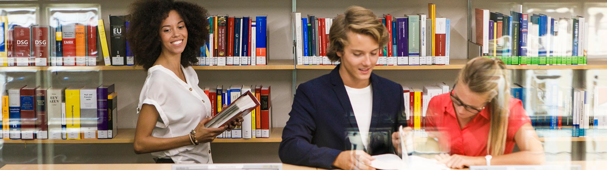 Students doing research in the library